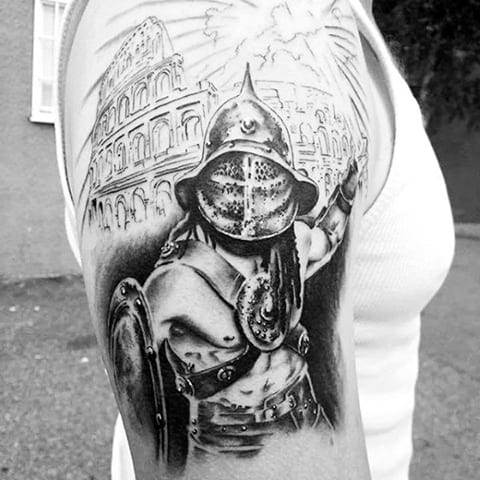 Tattoo gladiator on his shoulder