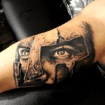 Tattoo of a gladiator's eyes