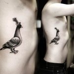 Tattoo of a dove on the ribs
