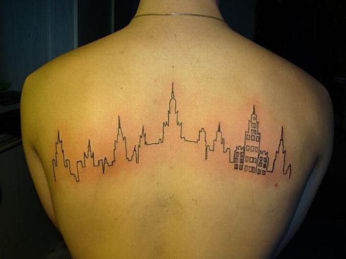 Tattoo of a city on her back