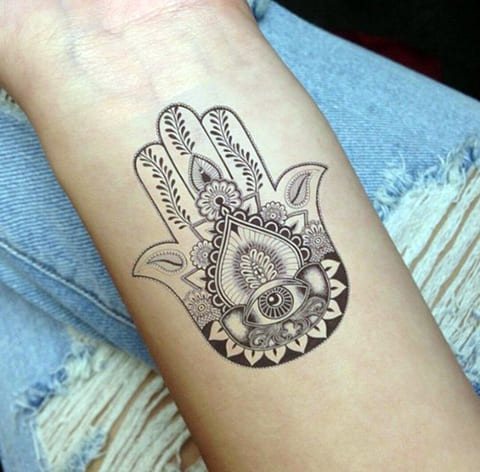 Hamsa tattoo on the arm