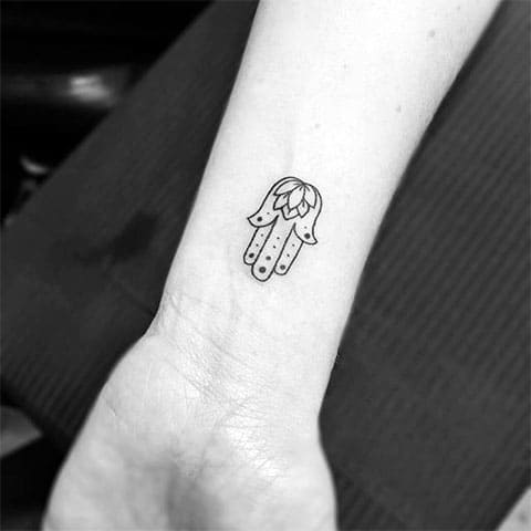 Tattoo of a hamsa on the wrist
