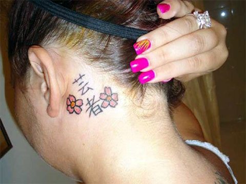 Tattoo Hieroglyphs behind the ear