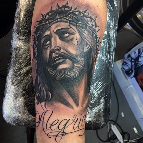Tattoo of Jesus Christ with a crown of thorns