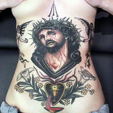 Tattoo Jesus Christ on a girl's stomach