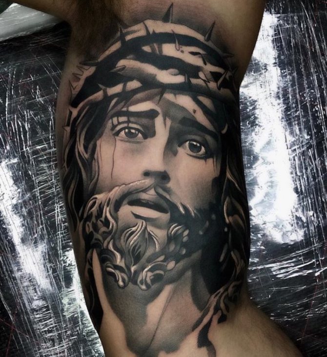 jesus christ tattoo on his arm