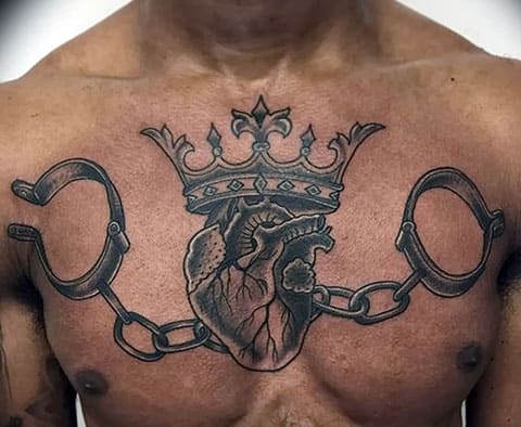 Tattoo shackles on his chest