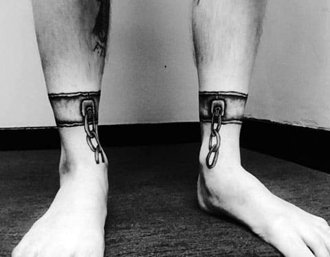 Tattoo shackles on legs