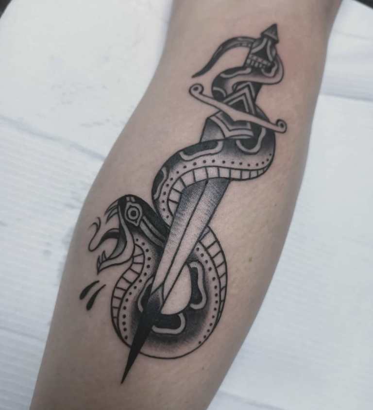 dagger tattoo with a snake