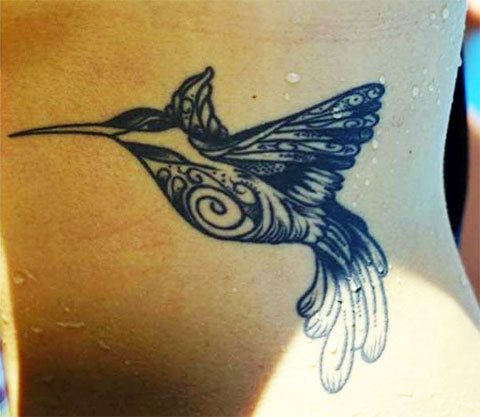 Black hummingbird tattoo