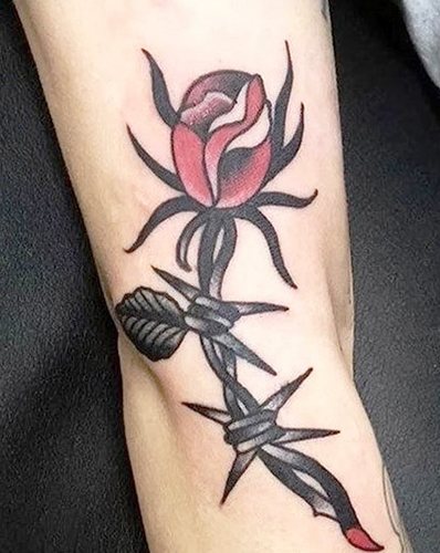 Barbed wire tattoo. Meaning on the foot, wrist, neck, leg, with flowers, rose, heart, cross