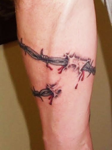 Tattoo barbed wire. Meaning on foot, wrist, neck, leg, with flowers, rose, heart, cross