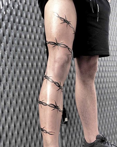 Barbed wire tattoo. Meaning on foot, wrist, neck, leg, with flowers, rose, heart, cross