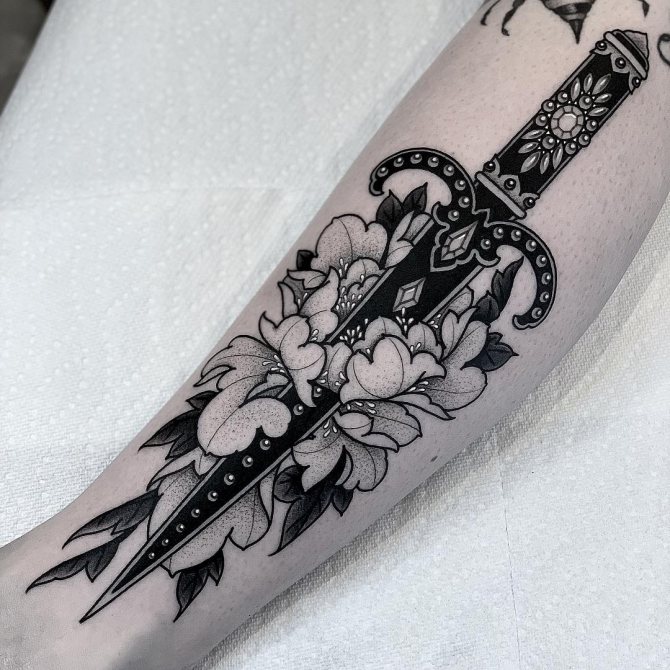Short Dagger with Flowers Forearm Tattoo