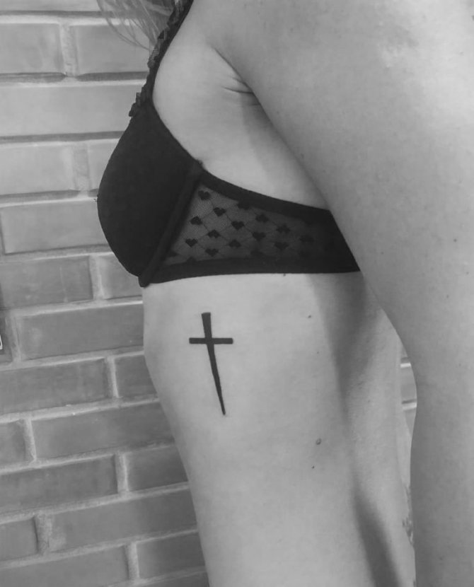 Tattoo a cross on the ribs