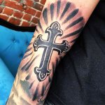 Tattoo cross on hand