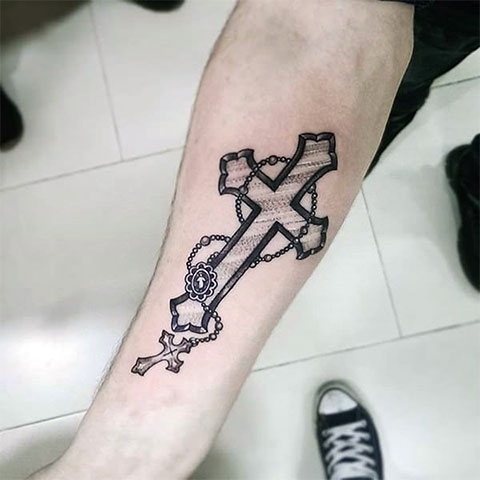 Tattoo cross on hand - photo