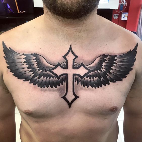 cross tattoo with wings on chest for men