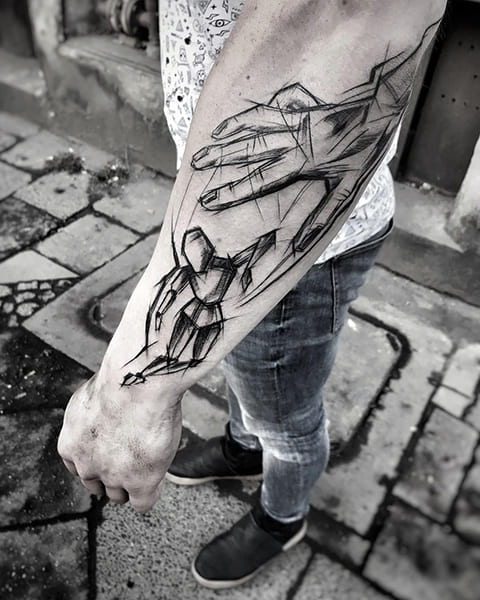 Tattoo of a puppeteer on his arm