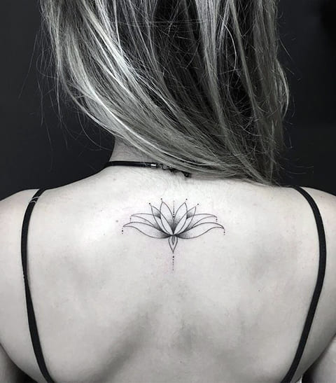 Tattoo of a lily on a girl's back
