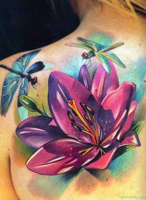 Water lily with dragonflies tattoo on back of a girl in watercolor style