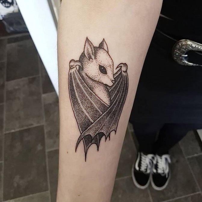bat dotwork tattoo on forearm