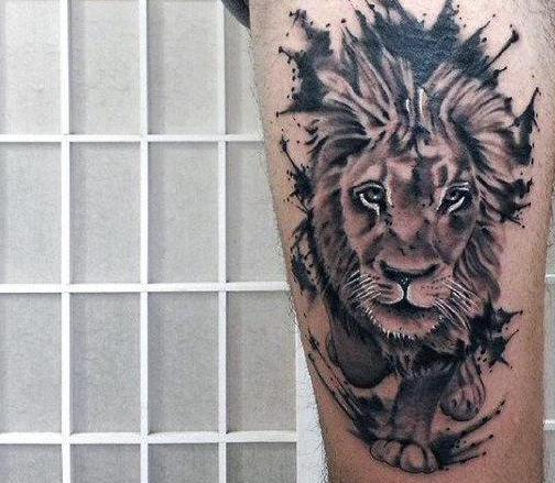 Tattoo of a lion on his thigh