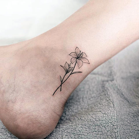 Tattoo lily on legs