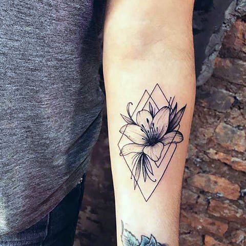 Tattoo of lily on hand for girls