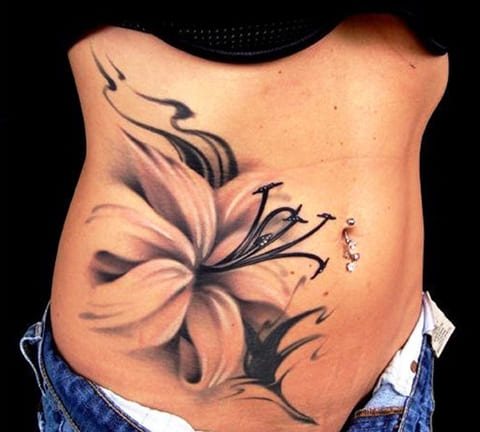 Tattoo girl's tummy with a lily