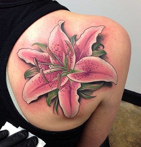 Tattoo of a lily on a girl