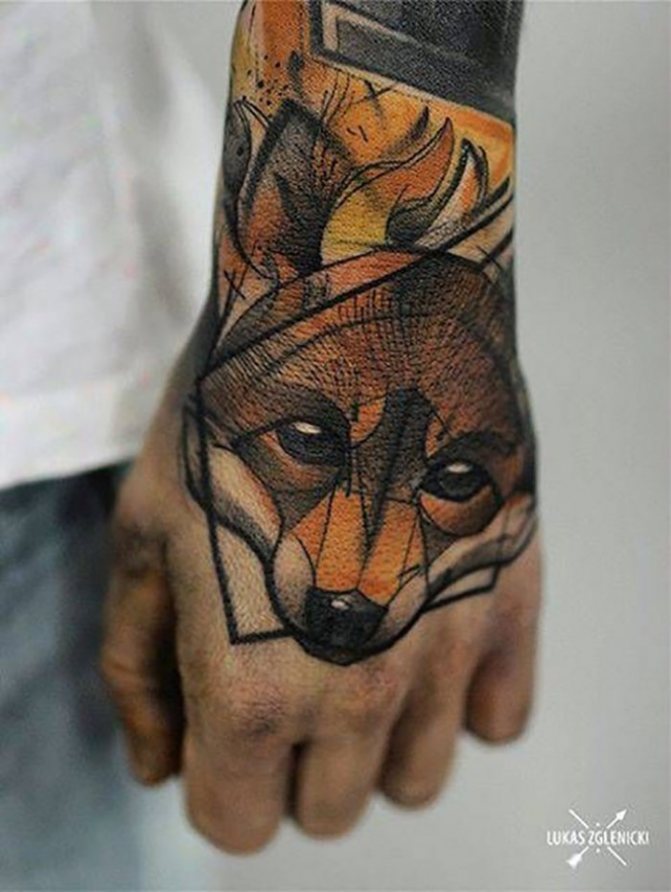 Tattoo of a fox on his arm