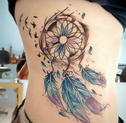 Tattoo of a dream catcher on the side