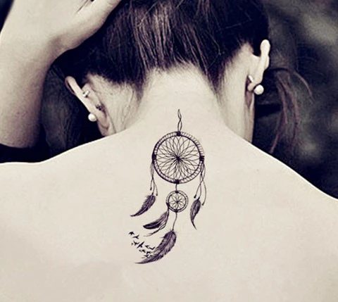 Tattoo of a dream catcher on a girl's neck