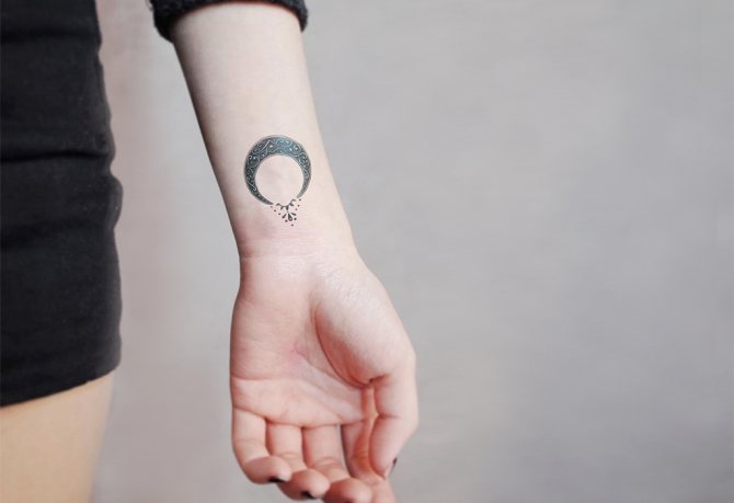 Moonraker tattoo on wrist