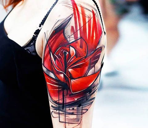 Tattoo poppy on a girl's shoulder - photo