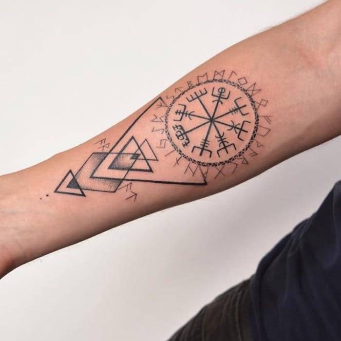 tattoo mandala with runes on forearm
