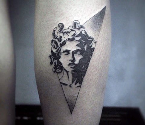 Medusa Gorgon tattoo on a calve
