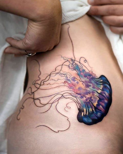 Tattoo jellyfish on a girl's side