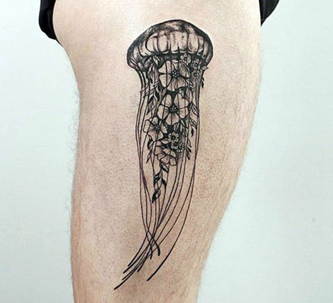 Tattoo of jellyfish on legs of men