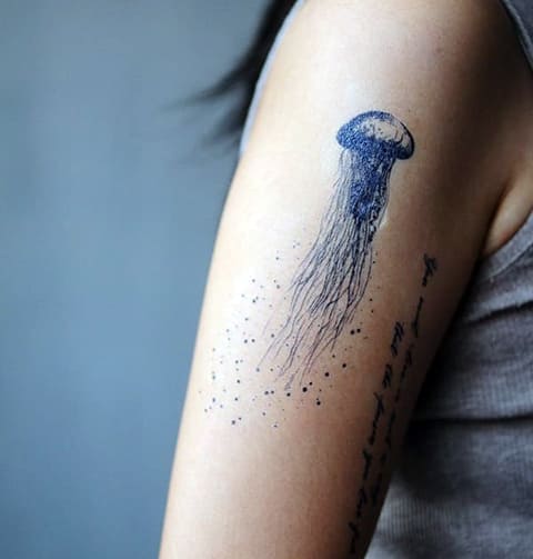 Tattoo jellyfish on girl's arm