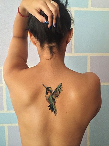 Tattoo between the shoulder blades for girls. Photo, meaning, sketches