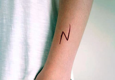 Lightning tattoo on a girl's arm
