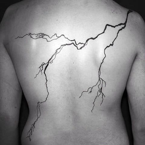 Lightning on back tattoo
