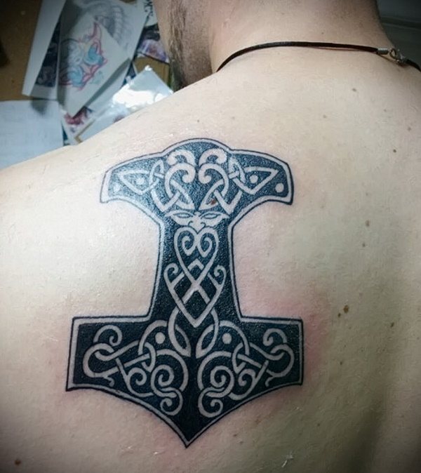 Tattoo Hammer Thor. Meaning on the arm, hand, back, shoulder, leg, photo