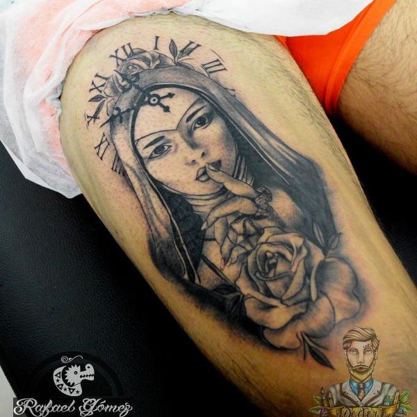 Tattoo nun with a clock on a guy's shin