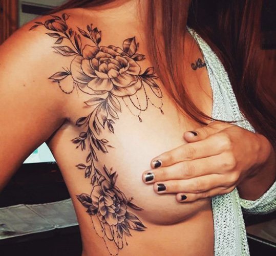 Tattoo on the chest in girls. Photos, inscriptions, sketches