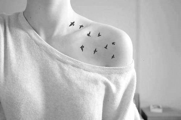 Tattoo on the collarbone for girls. Sketches, women's lettering, patterns, birds, flowers, stars