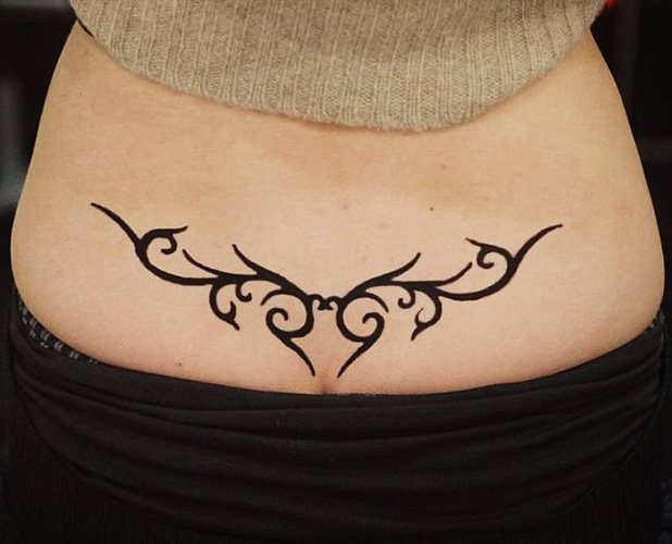Tatuaggio sul coccige per ragazze. Foto e significato