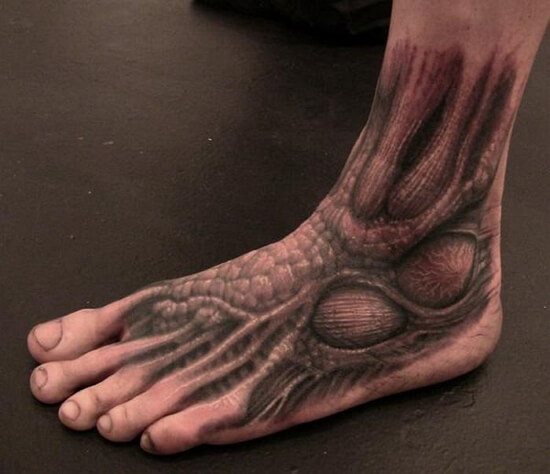 Tattoo on the leg men's photo